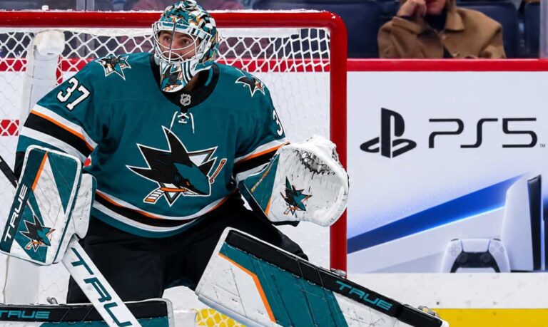 Connor Hellebuyck in a San Jose Sharks uniform amid NHL trade rumors linking the Winnipeg Jets goalie to San Jose