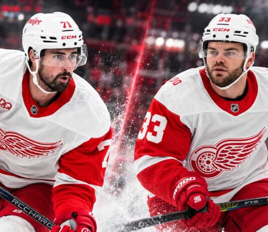 Dylan Larkin and Alex DeBrincat in Detroit Red Wings jerseys as DeBrincat's $91 million contract extension raises questions about Larkin's future amid NHL trade rumors.