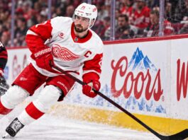 Dylan Larkin skates for the Detroit Red Wings amid NHL trade rumors after being booed during the 2026 home opener.