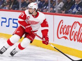 Dylan Larkin skating for the Detroit Red Wings as trade rumors continue following his opening-week injury.