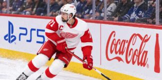 Dylan Larkin skating for the Detroit Red Wings as trade rumors continue following his opening-week injury.