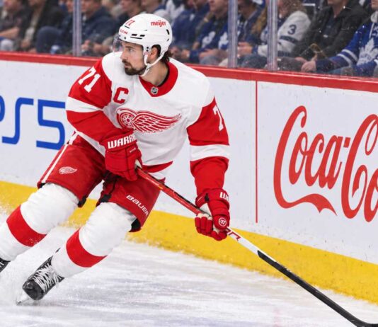 Dylan Larkin skating for the Detroit Red Wings as trade rumors continue following his opening-week injury.