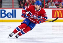 Dylan Larkin pictured in a Montreal Canadiens home jersey amid NHL trade rumors linking the Detroit Red Wings captain to a potential blockbuster trade with Montreal.