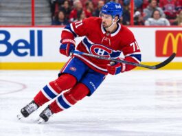 Dylan Larkin pictured in a Montreal Canadiens home jersey amid NHL trade rumors linking the Detroit Red Wings captain to a potential blockbuster trade with Montreal.