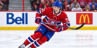 Dylan Larkin pictured in a Montreal Canadiens home jersey amid NHL trade rumors linking the Detroit Red Wings captain to a potential blockbuster trade with Montreal.