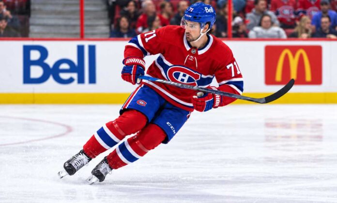 dylan-larkin-montreal-canadiens-detroit-red-wings-trade-rumors-2026 Dylan Larkin pictured in a Montreal Canadiens home jersey amid NHL trade rumors linking the Detroit Red Wings captain to a potential blockbuster trade with Montreal.