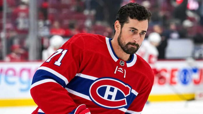 dylan-larkin-red-wings-canadiens-trade-rumors-2026 Dylan Larkin pictured in a Montreal Canadiens home jersey as NHL trade rumors intensify following reports that the Detroit Red Wings are scouting Montreal.