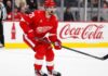 Dylan Larkin Held Out as Red Wings Trade Talks Escalate: Four Teams Emerge Detroit Red Wings centre Dylan Larkin skates during an NHL game as trade negotiations involving several teams intensify.