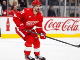 Detroit Red Wings centre Dylan Larkin skates during an NHL game as trade negotiations involving several teams intensify.