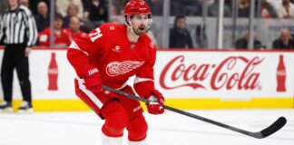 Dylan Larkin Held Out as Red Wings Trade Talks Escalate: Four Teams Emerge Detroit Red Wings centre Dylan Larkin skates during an NHL game as trade negotiations involving several teams intensify.
