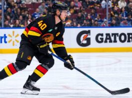 Elias Pettersson skating for the Vancouver Canucks as trade rumors grow following his strong start to the 2026-27 NHL season.