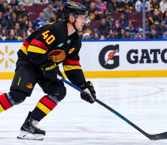 Elias Pettersson skating for the Vancouver Canucks as trade rumors grow following his strong start to the 2026-27 NHL season.