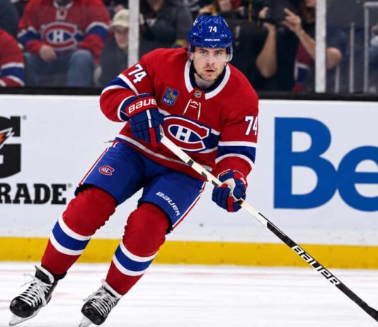 Jake DeBrusk wearing a Montreal Canadiens home jersey and helmet with number 74 in a trade concept image, as NHL rumors connect the Vancouver Canucks forward to Montreal.