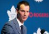 John Chayka Says Maple Leafs Need Better Defence — Calgary Just Showed Why Toronto Maple Leafs general manager John Chayka speaking at a team press conference as Toronto evaluates defensive improvements and potential NHL trades.