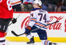 Oilers Trade Rumors: Could Philadelphia’s Nightmare Start Finally Make Owen Tippett Available? Owen Tippett pictured in an Edmonton Oilers away jersey in a trade rumor concept image as Edmonton considers the Philadelphia Flyers winger amid Philadelphia's 0-5-2 start.