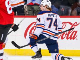 Owen Tippett pictured in an Edmonton Oilers away jersey in a trade rumor concept image as Edmonton considers the Philadelphia Flyers winger amid Philadelphia's 0-5-2 start.