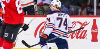 Owen Tippett pictured in an Edmonton Oilers away jersey in a trade rumor concept image as Edmonton considers the Philadelphia Flyers winger amid Philadelphia's 0-5-2 start.