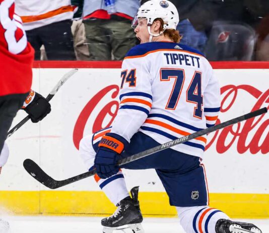 Owen Tippett pictured in an Edmonton Oilers away jersey in a trade rumor concept image as Edmonton considers the Philadelphia Flyers winger amid Philadelphia's 0-5-2 start.