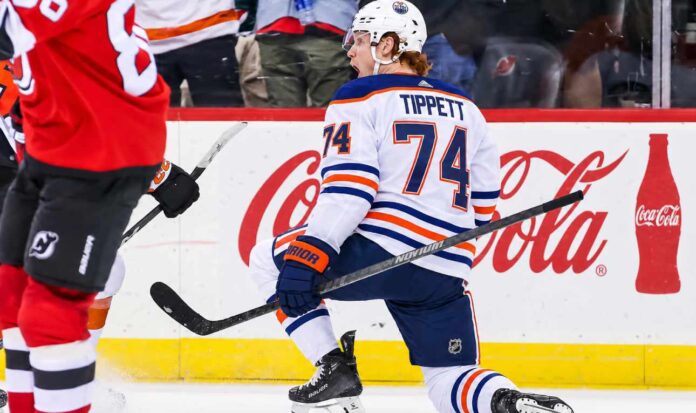 owen-tippett-edmonton-oilers-philadelphia-flyers-trade-rumors-2026 Owen Tippett pictured in an Edmonton Oilers away jersey in a trade rumor concept image as Edmonton considers the Philadelphia Flyers winger amid Philadelphia's 0-5-2 start.