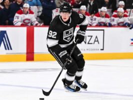 Patrik Laine wearing a Los Angeles Kings home jersey and black helmet in a conceptual image illustrating NHL free-agent signing rumors linking him to LA in 2026.