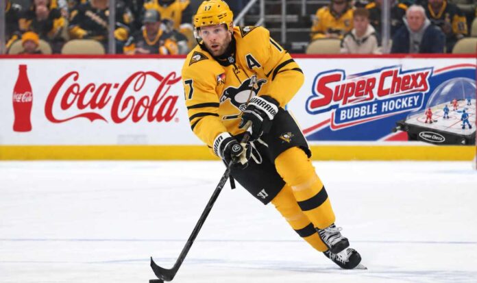 pittsburgh-penguins-bryan-rust-trade-rumors-2026 Bryan Rust of the Pittsburgh Penguins skates with the puck as NHL trade rumors intensify amid speculation that Kyle Dubas could move veteran players in a roster shakeup.