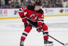 Quinn Hughes Trade Rumors Take a New Turn After Devils’ Blockbuster Quinn Hughes pictured in a New Jersey Devils home jersey as NHL trade rumors link the Minnesota Wild defenseman to New Jersey following the Connor Hellebuyck blockbuster trade.