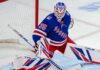 Rangers Trade Rumors: Did Montreal Just Make Sam Montembeault Expendable? Sam Montembeault wearing a New York Rangers home jersey and goalie equipment in a mock trade image highlighting NHL trade rumors involving the Montreal Canadiens.