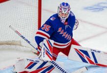 Rangers Trade Rumors: Did Montreal Just Make Sam Montembeault Expendable? Sam Montembeault wearing a New York Rangers home jersey and goalie equipment in a mock trade image highlighting NHL trade rumors involving the Montreal Canadiens.