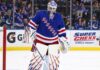 Vancouver Canucks vs. New York Rangers Fantasy Hockey Prediction: Players to Watch, Score Pick & How to Watch New York Rangers goalie Igor Shesterkin in front of his net with Gatorade and Super Chexx Bubble Hockey board ads and Canucks and Rangers fans in the stands.