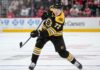 Simon Edvinsson Trade Rumors: Bruins Circle as Detroit Faces a $77 Million Decision Simon Edvinsson wearing a Boston Bruins home jersey and helmet in a hypothetical uniform swap as NHL trade rumors link the Bruins to the Detroit Red Wings defenseman.