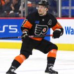 Flyers Hit Rock Bottom: Is a Travis Konecny Blockbuster Now on the Table? Travis Konecny wearing his Philadelphia Flyers home jersey during an NHL game as trade rumors intensify following the Flyers' historic winless start to the 2026-27 season.