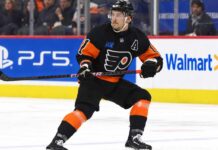 Flyers Hit Rock Bottom: Is a Travis Konecny Blockbuster Now on the Table? Travis Konecny wearing his Philadelphia Flyers home jersey during an NHL game as trade rumors intensify following the Flyers' historic winless start to the 2026-27 season.