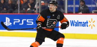 Travis Konecny wearing his Philadelphia Flyers home jersey during an NHL game as trade rumors intensify following the Flyers' historic winless start to the 2026-27 season.