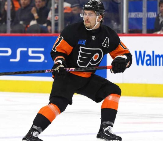 Travis Konecny wearing his Philadelphia Flyers home jersey during an NHL game as trade rumors intensify following the Flyers' historic winless start to the 2026-27 season.